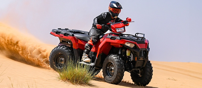 Quad bike tours banner by Saz Dubai, offering exciting off-road adventures in the Dubai desert.