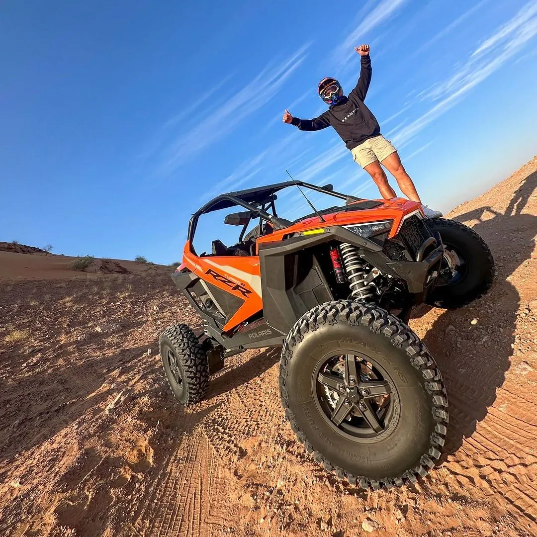 Image of Customer on Buggy in the Desert.